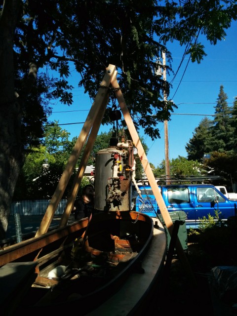 tripod and chain hoist removing boiler