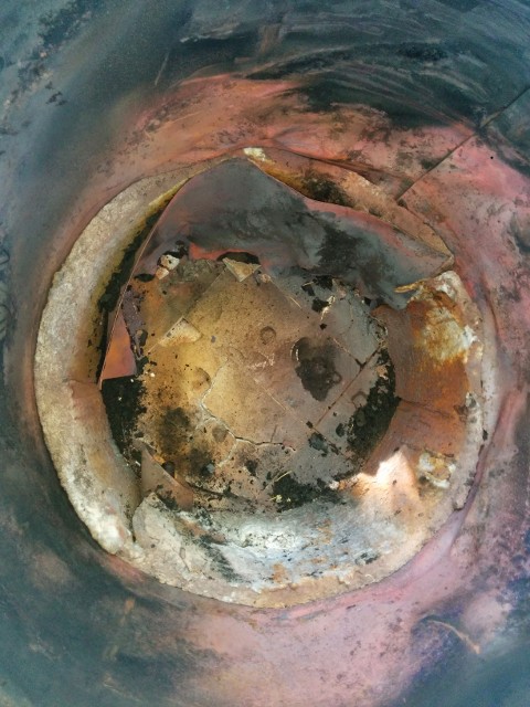 kaowool liner, stainless doubler.  All warped to h*ll and gone.